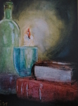 Books, candle and bottle of wine